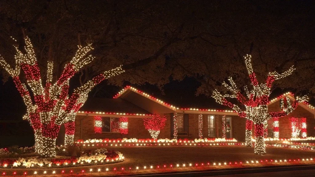 christmas light installation on a house